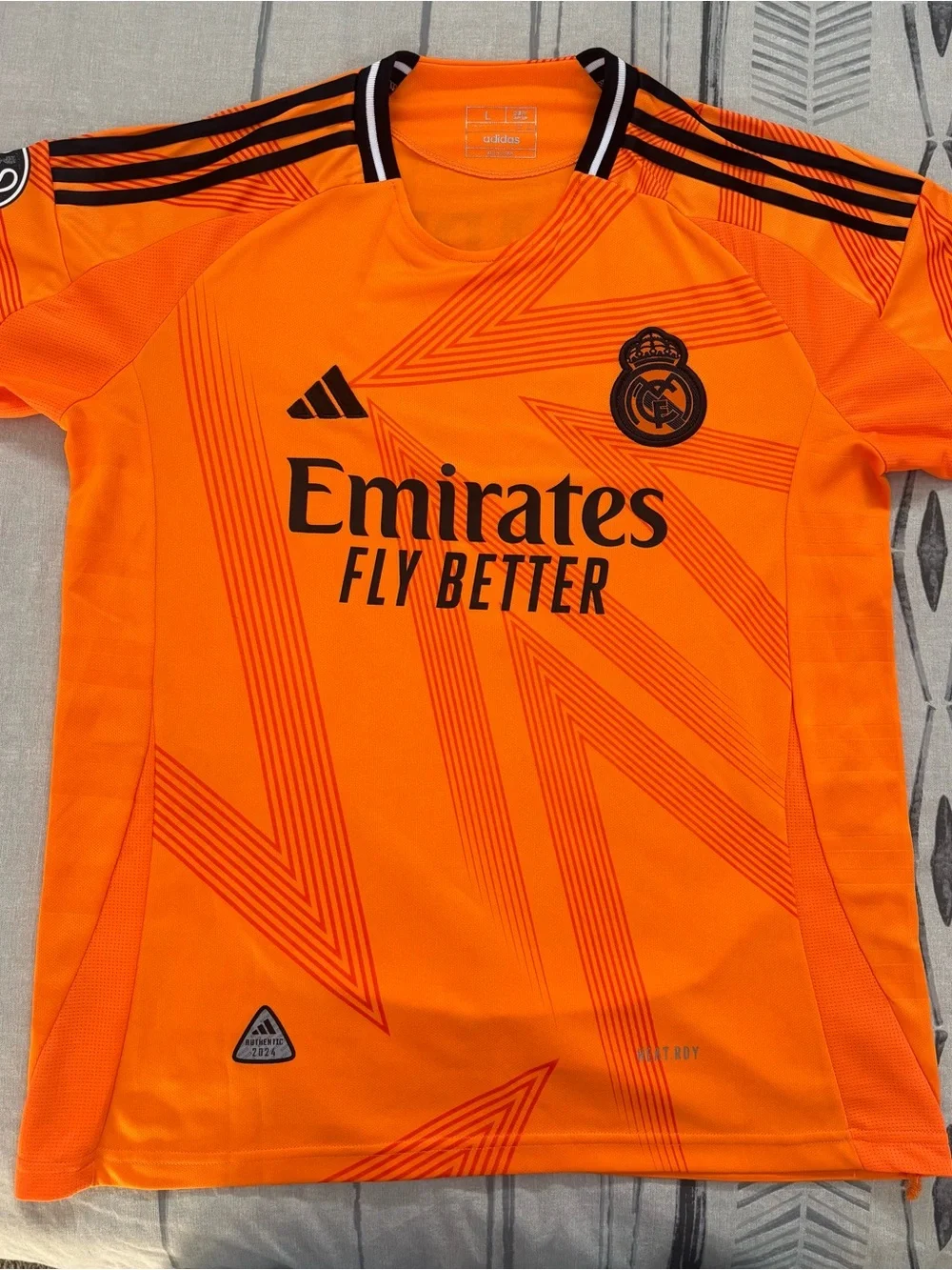 adidas Men’s Bright Orange Real Madrid Training Jersey with Black Accents